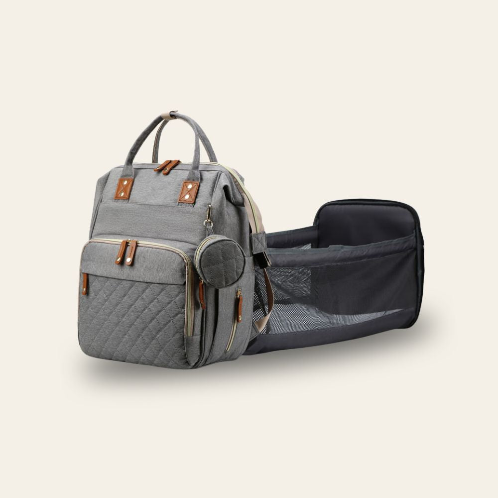 Sac à langer Shibi gris avec lit d'appoint portable déplié, vue latérale